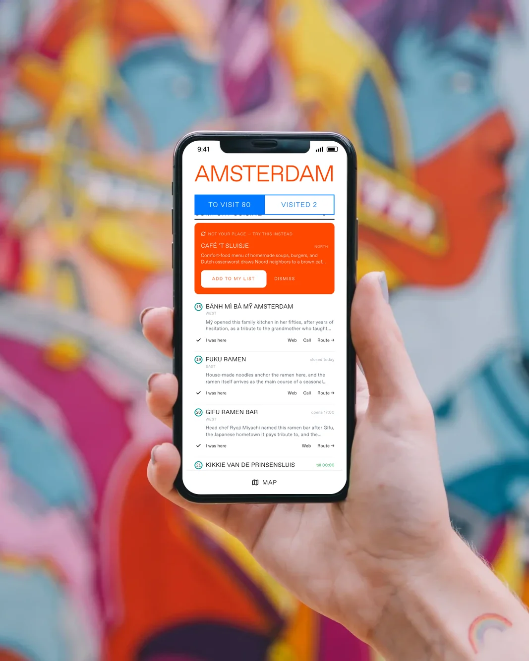 A phone in a hand against a bright street mural: the guide offers a replacement, “Not your place, try this instead”, with Café ’t Sluisje and an Add to my list button
